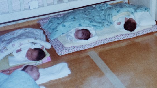 Rows of babies waiting for overseas adoption in 1984 at the Angel Babies’ Home orphanage.
