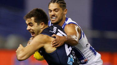 Jack Martin is tackled by Aaron Hall.