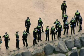 Police wait for protesters in Northcote on Friday afternoon.
