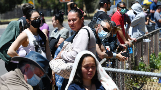 Adelaide residents queue for a coronavirus test at Parafield Gardens in Adelaide on Tuesday.