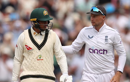 Usman Khawaja congratulated by Joe Root.