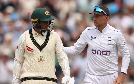 Usman Khawaja congratulated by Joe Root.