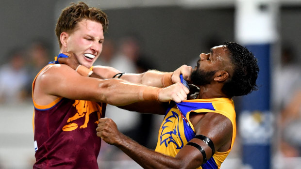 Alex Witherden grapples with Liam Ryan (right) during the Eagles' loss to Brisbane on Saturday night.
