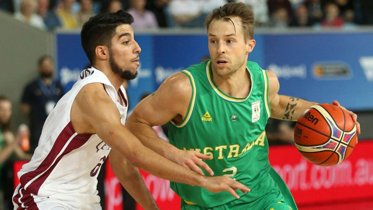 Green and bold: Hamish Blair on the ball with Australia in full control against Qatar.