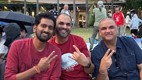 Work friends Ram (left), Shiv (centre), and Sunny (right) were planning to stay in the city with their families until midnight.