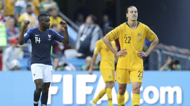 Gutted: Jackson Irvine looks dejected as Blaise Matuidi celebrated at the full time whistle.