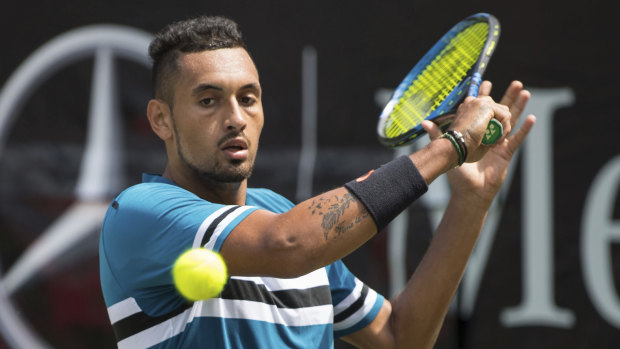 Nick Kyrgios returns the ball to Maximilian Marterer on his way to a win.