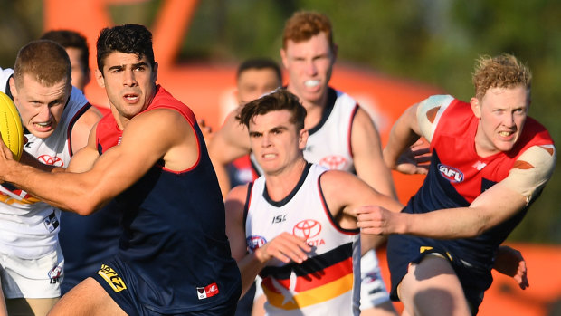 Christian Petracca dashes clear of the pack.