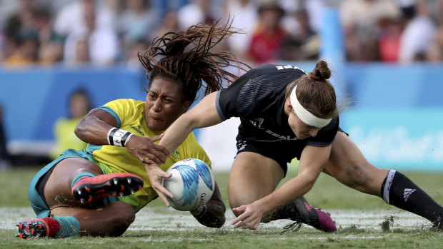Eight-hour job: Ellia Green's locks, the result of an elaborate pre-game ritual, fly against New Zealand. 