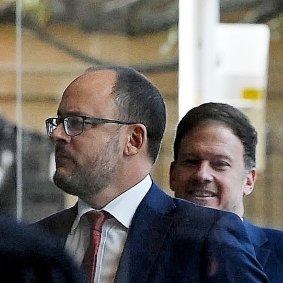 ABC journalists Mark Willacy (left) and Josh Robertson arrive at the Federal Court in Sydney on Friday.