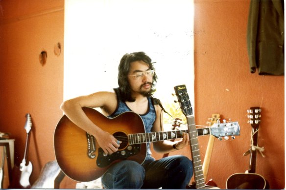 Kazuo Ishiguro playing guitar in the British summer of 1977 in Broad Oak, Kent. 