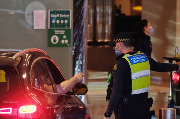 Police outside the Grand Hyatt Hotel in Melbourne, where Australian Open players and their support teams are staying.