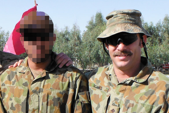 Captain Jason Scanes (right) in Afghanistan with Hassan.