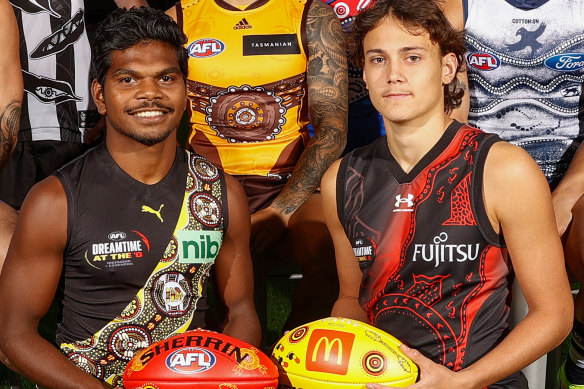 Maurice Rioli and Tex Wanganeen show off the Tigers and Bombers’ 2022 Indigenous jumpers.