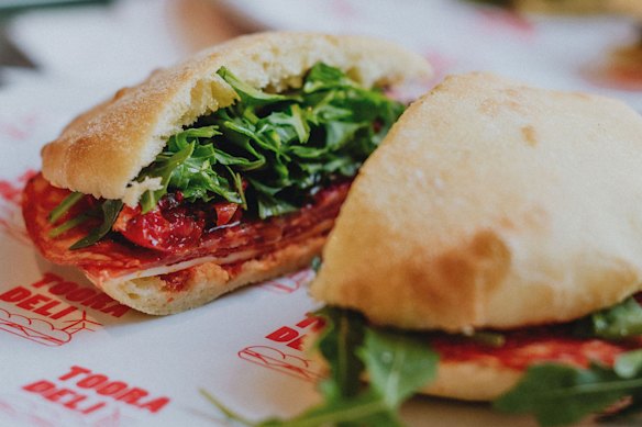 A house-baked puccia with hot salami, provolone, semi-dried tomatoes, rocket and chilli at Tooradeli.