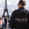 French police officers patrol near the Eiffel Tower last month.