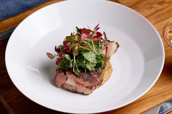 White Pyrenees lamb rump with charred leek, herb salad, sumac and a coffee jus.