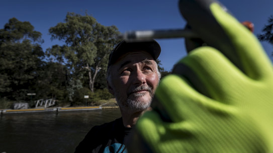 Yarra Riverkeeper Andrew Kelly picks up one of the estimated tens of thousands of syringes that are lying in the Yarra and its river beds. 