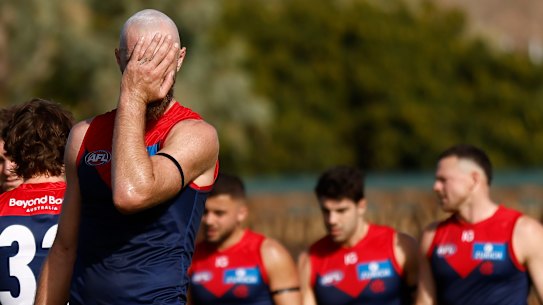 Skipper Max Gawn leads his beleaguered team off the field after their lamentable performance against Fremantle in Alice Springs.