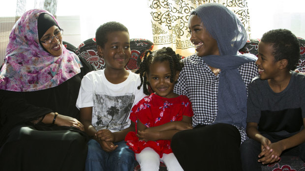 A happy and healthy Hussein (second from left) with his family after an organ donation saved his life.