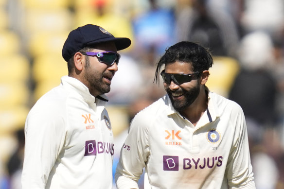 Ravindra Jadeja, right, celebrates with captain Rohit Sharma after taking the wicket of Todd Murphy.