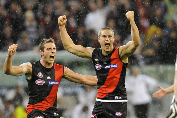 David Zaharakis (right) after his famous Anzac Day goal in 2009.