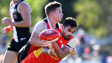 Jack Billings takes down Gold Coast's Jack Martin.