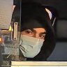 This photo released by the New York Police Department shows a suspect in the fatal shooting of UnitedHealthcare CEO Brian Thompson in a taxi. 