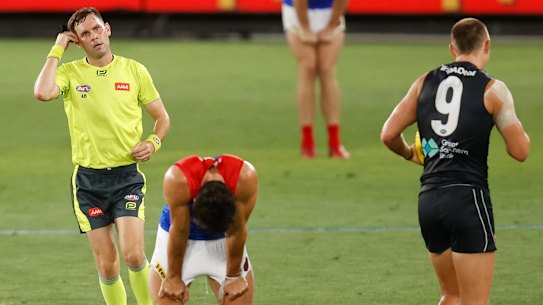 Christian Petracca reacts after a 50m penalty is paid against the Demons on Thursday night.