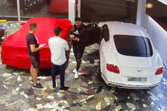 CCTV captures Mostafa Baluch collecting a Bentley from a luxury car dealership in Woolloomooloo in May.