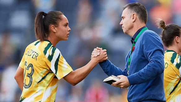Matildas defender Emma Checker with coach Ante Milicic.