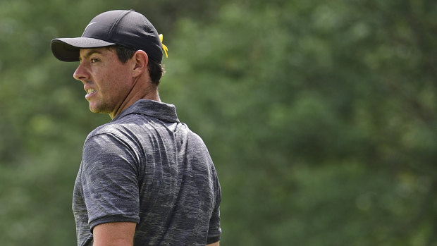 Respect: Rory McIlroy wears a ribbon in support of Jarrod Lyle on the back of his hat.