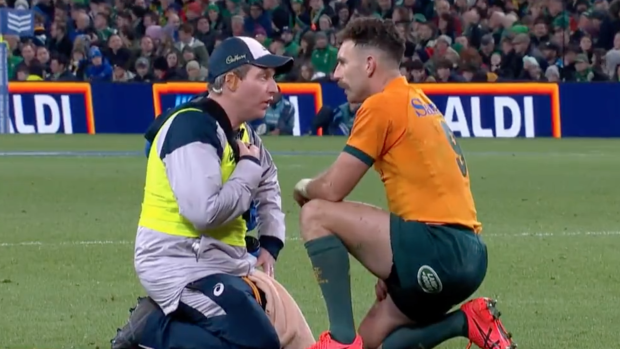 Nic White with Wallabies physio Keiran Cleary during Australia’s Test against Ireland.