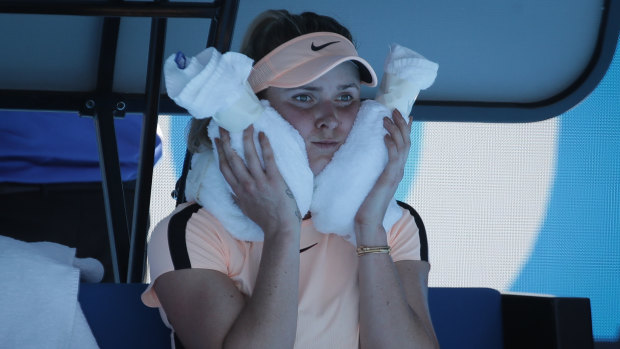 Elina Svitolina cools off  on Rod Laver Arena. 