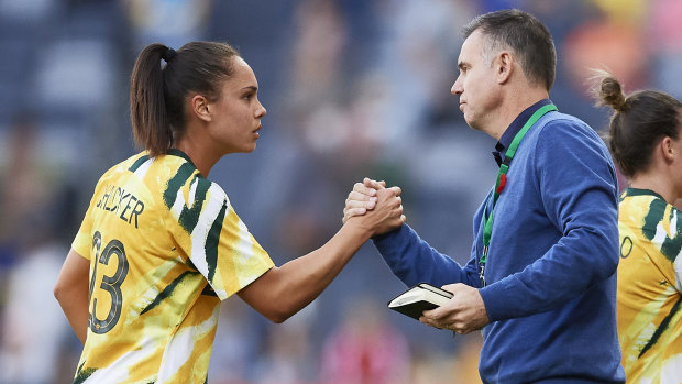 Matildas defender Emma Checker with coach Ante Milicic.
