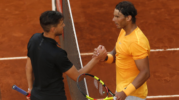 King crusher: A crestfallen Nadal congratulates Thiem after the match.