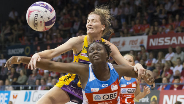 Disputed possession: Karla Pretorius of the Lightning and Sam Wallace of the Swifts contest the ball at the Quaycentre in Sydney.