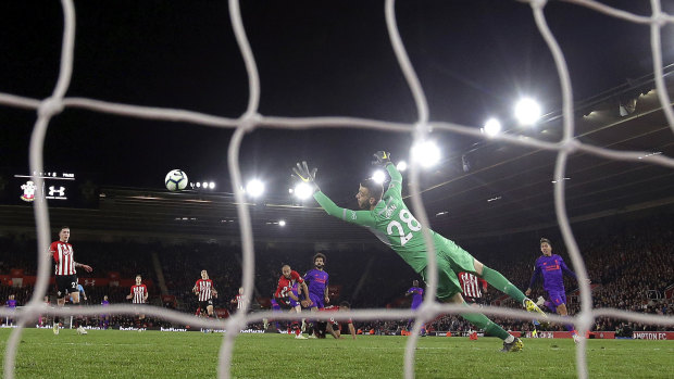 Liverpool's Mohamed Salah, centre, scores his side's second goal in their 3-1 win over Southampton at St Mary's stadium in Southampton on Friday.  