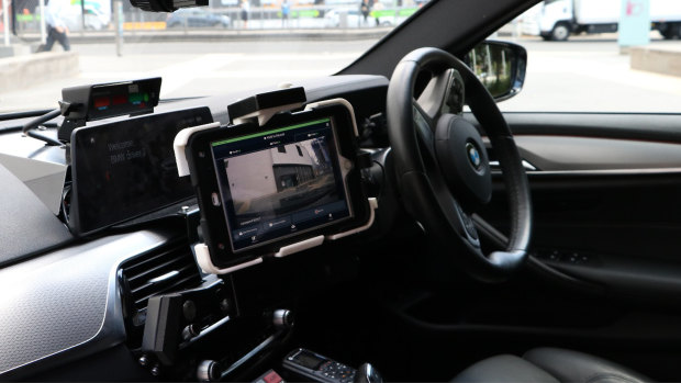The camera connects to an iPad inside the patrol car.