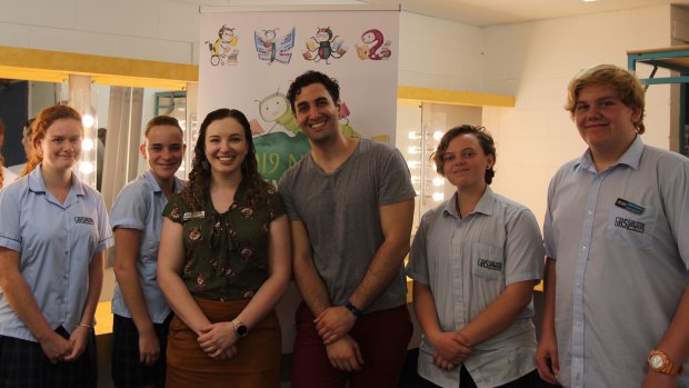 Teacher librarian Jade Arnold (third from left) with author Will Kostakis (third from right) and students.