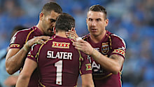 Darius Boyd embraces Billy Slater during their playing days.