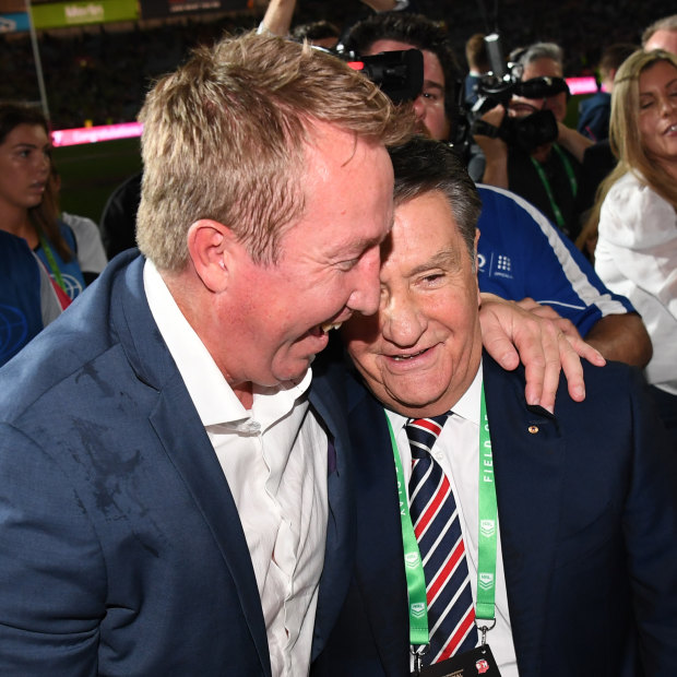 Trent Robinson and Politis share a moment after the 2019 grand final.