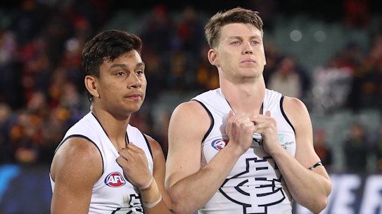 Sam Walsh and Jesse Motlop take a moment after Carlton’s loss.