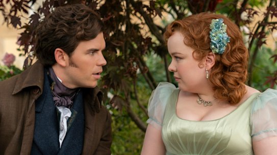 Luke Newton as Colin Bridgerton, Nicola Coughlan as Penelope Featherington in season three of Bridgerton. 