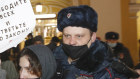 Police officers detain a supporter of Alexei Navalny during a rally in St Petersburg.