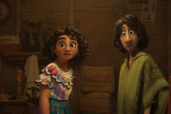 Mirabel, voiced by Stephanie Beatriz, and Bruno, voiced by John Leguizamo, in a scene from Encanto.