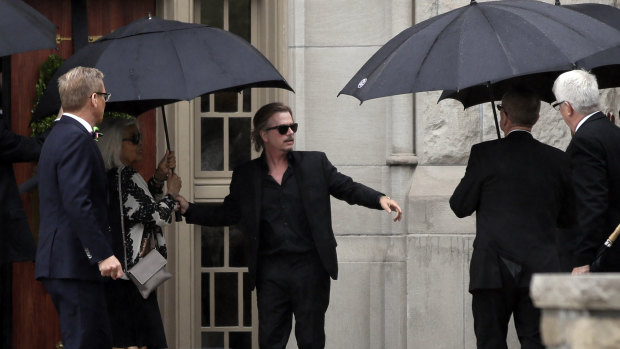 Actor-comedian David Spade helps family members enter Our Lady of Perpetual Help Redemptorist Catholic Church for funeral services for his sister-in-law, designer Kate Spade, in Kansas City.
