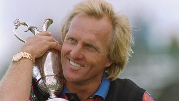 Greg Norman hugs the Claret Jug after winning the British Open Golf Championship in 1993.