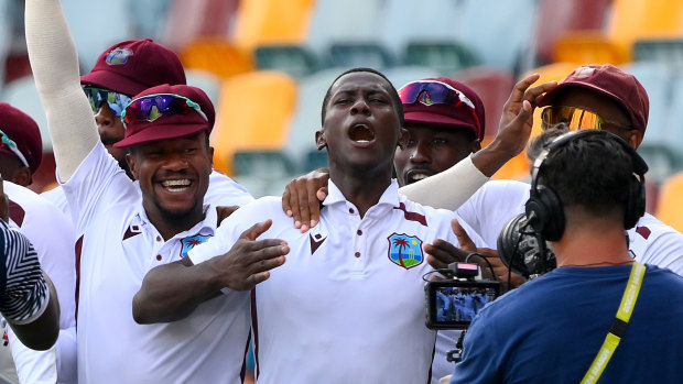 Shamar Joseph celebrates a remarkable Test victory with teammates at the Gabba.
