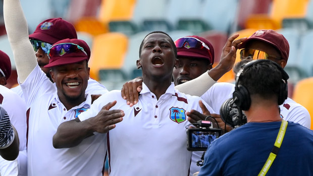 Shamar Joseph celebrates a remarkable Test victory with teammates at the Gabba in January.